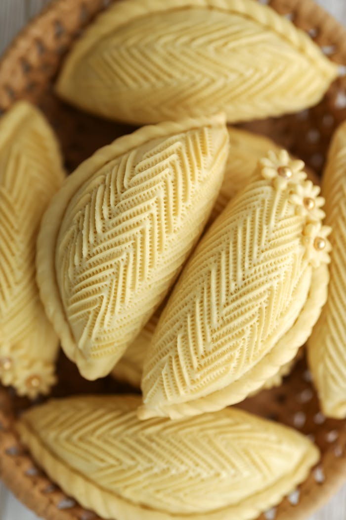 Delightful close-up of Azerbaijani Shekarbura pastries showcasing intricate patterns.